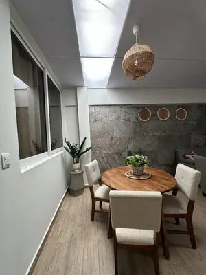a dining room with a table and chairs at Apartment D Fuertevali in San Salvador
