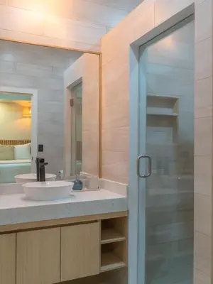 a bathroom with a sink and a glass shower at Miradora House in El Sunzal