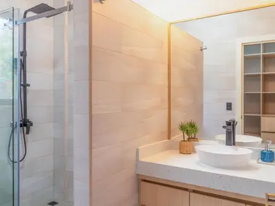 a bathroom with a sink and a shower at Miradora House in El Sunzal