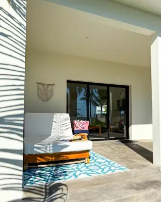 a living room with a couch and a rug at Azul Beach House in La Esmeralda