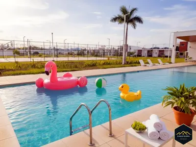 a swimming pool with inflatables in a resort at Casa Brisa Volcanica - Residencial Nueva San Miguel with AC in San Miguel