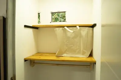 a tote bag sitting on a shelf in a room at Amalfi Surf Lodge in ChiltiupÃ¡n