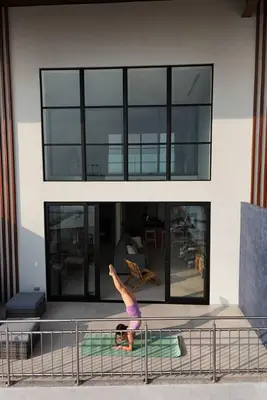 a person on a bed in front of a building at Oceanview Loft Mare in Playa San Blas