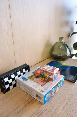 a stack of books sitting on top of a table at Oceanview Loft Mare in Playa San Blas