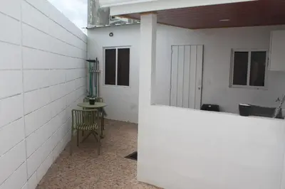 a room with a chair and a table in a building at Casa maea loma alta in Sonzacate