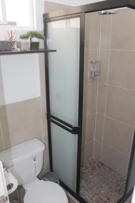 a bathroom with a shower with a toilet at Casa maea loma alta in Sonzacate