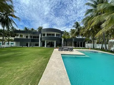 an exterior view of a house with a swimming pool at House in Costa del Sol with beach access 5 bedrooms in Marcelino