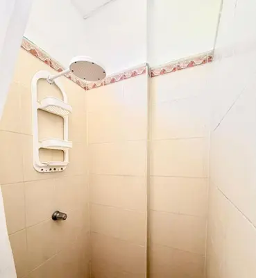 a bathroom with a shower with a mirror at Hotel Pablo Tesák in San Vicente