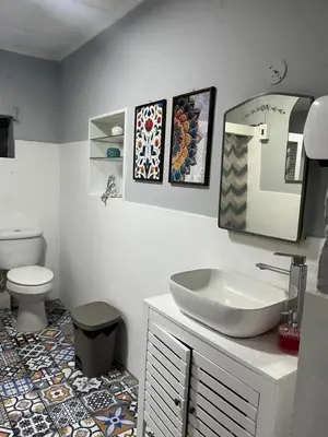 a bathroom with a sink and a toilet at Club 27 - Hostal, Cafe & Spa in Santa Ana