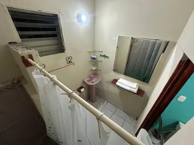 a small bathroom with a sink and a mirror at Hostal las brisas in El Rosario