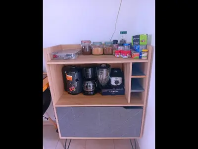 a wooden shelf with a coffee maker on it at Casa de Milo in Ahuachapán