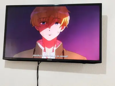 a television screen with an anime character on it at La casa de Alex in San Juan Opico