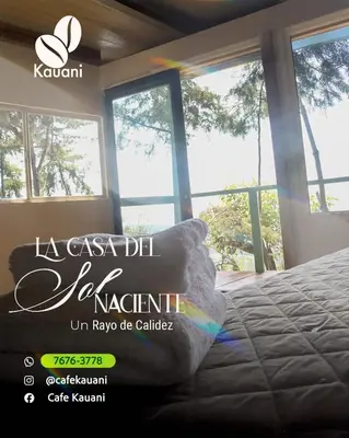 a bedroom with a bed and windows in a room at Cabañas y Café Kauani