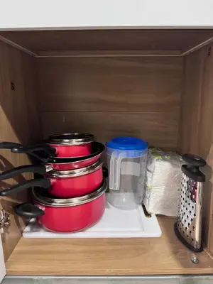 a stack of pots and pans in a kitchen drawer at La Santanita in Santa Ana