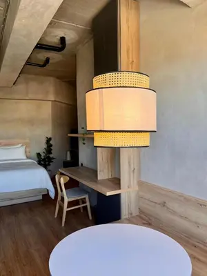 a bedroom with a bed and a table and a bed sqor at Modern and Stylish Studio Near Parks El Espino District in San Salvador