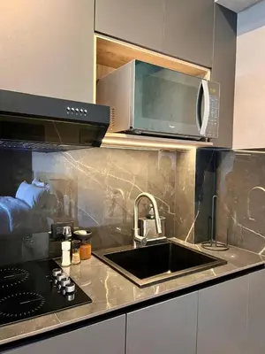a kitchen with a sink and a microwave at Modern and Stylish Studio Near Parks El Espino District in San Salvador