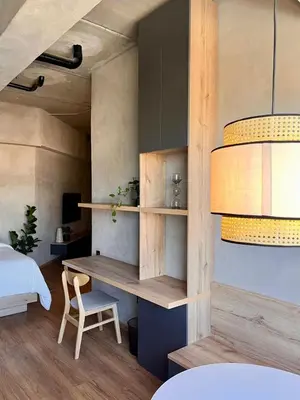 a bedroom with a desk and a bed and a table at Modern and Stylish Studio Near Parks El Espino District in San Salvador