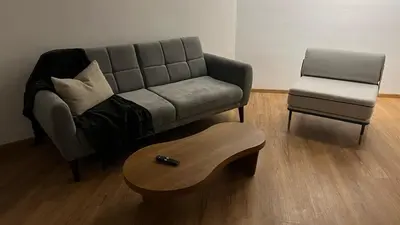 a living room with a couch and a chair at Modern and Stylish Studio Near Parks El Espino District in San Salvador