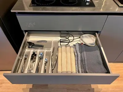 a drawer in a kitchen with various kitchen utensils at Modern and Stylish Studio Near Parks El Espino District in San Salvador