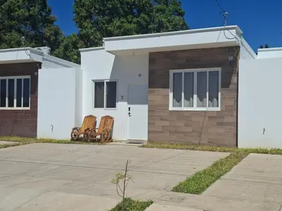 a house with two chairs in front of it at Nueva San Miguel - Casa Chaparrastique in San Miguel