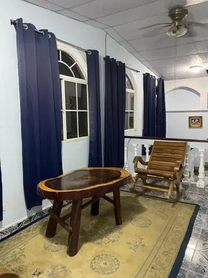 a room with a wooden table and a bench at Hostal Morales García in San Marcos