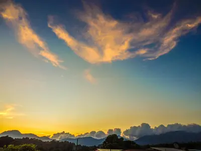 a sunset with clouds in the sky at Hostal la Majada la Vida es Bella in San José La Majada