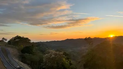 a sunset over a road with the sun in the sky at New, Peaceful Bonavista Home! in Zaragoza