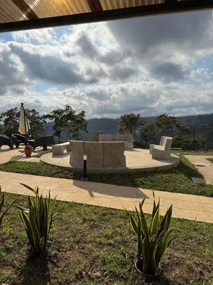 a park with concrete benches and plants on a sidewalk at New, Peaceful Bonavista Home! in Zaragoza