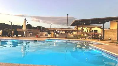 a large swimming pool with blue water at New, Peaceful Bonavista Home! in Zaragoza