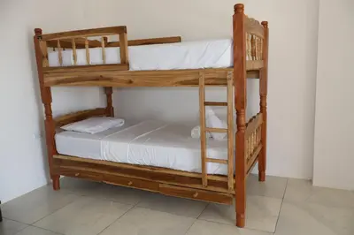 a pair of bunk beds in a room at Beachfront House The Hope in San Luis