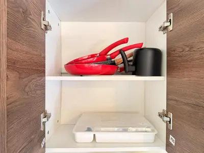a cupboard with some items in it at Cozy Loft with pool and beach in Surf City in La Libertad