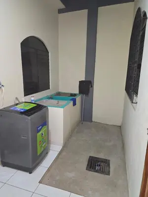a room with a machine in the corner of a room at The Stone Way Suite in Juayúa