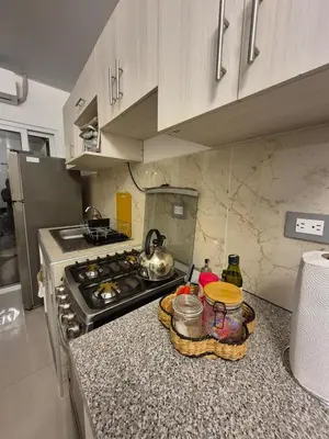 a kitchen with a stove and a counter top at Casa Mia en San Miguel