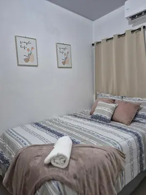 a bedroom with a bed with towels on it at Casa Mia en San Miguel