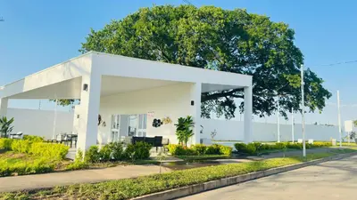 a white building on the side of a road at Casa de Sasha