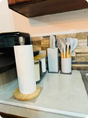 a kitchen counter with utensils on a counter top at La casita de oly in Concepción de Ataco