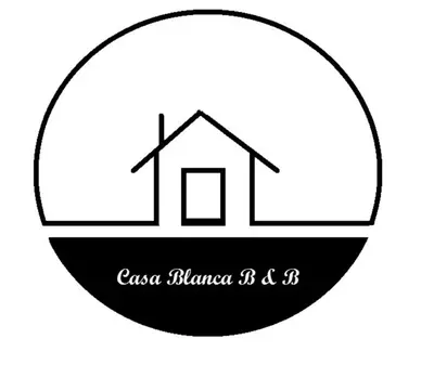 a black and white logo of a house in a circle at Casa Blanca Tu Casa in Santa Ana