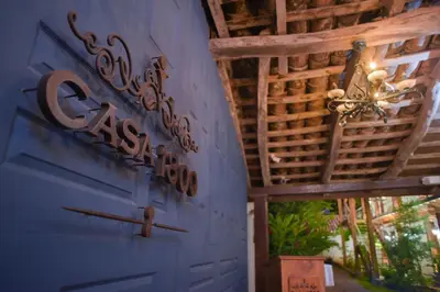a room with a blue door and a ceiling with a chandelier at Casa 1800 Suchitoto Boutique in Suchitoto