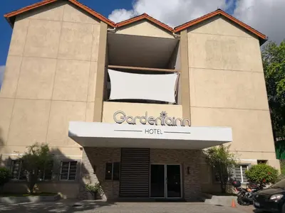 a building with a sign that reads gardening hotel at Hotel Gardenia Inn in San Salvador