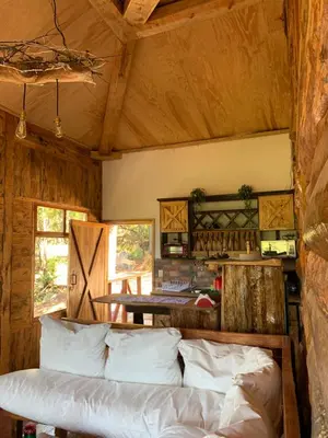 a living room with a couch and a table at Villa Verde in Perquín
