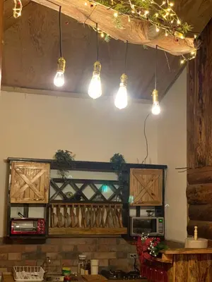 a kitchen with lights hanging from the ceiling at Villa Verde in Perquín