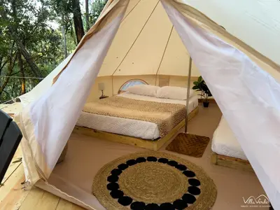 a bedroom with a bed in a tent at Villa Verde in Perquín