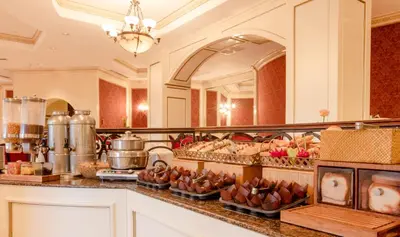 a kitchen with a bunch of food on a counter at Barceló San Salvador in San Salvador