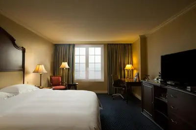 a hotel room with a bed and a television at Barceló San Salvador in San Salvador