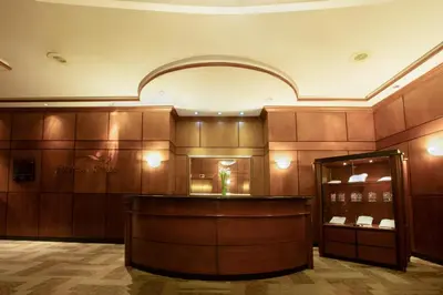a lobby with a bar in a building at Barceló San Salvador in San Salvador