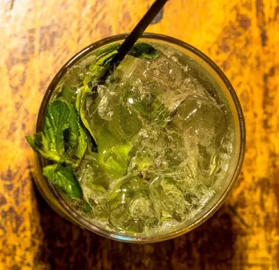 a close up of a drink in a glass at Hotel & Restaurant Fleur de Lis in Concepción de Ataco