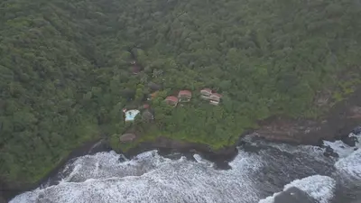 an aerial view of a house on a island in the ocean at Paraiso Escondido Hotel Villas & Resort in El Níspero