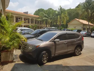 a silver suv parked in a parking lot at Hotel Florencia in San Miguel