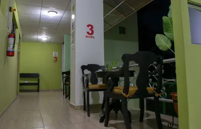 a row of chairs in a waiting room at Hostal de Asturias in San Salvador