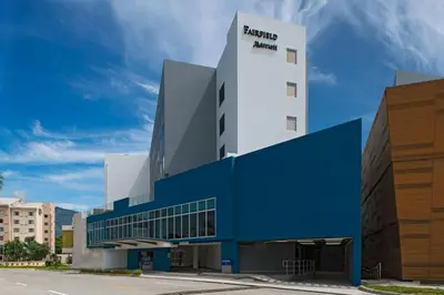 a building with a blue and white at Fairfield by Marriott San Salvador in San Salvador